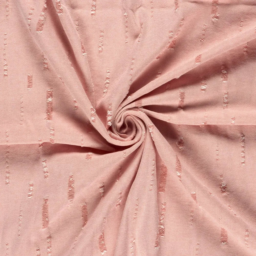 Rosa Jeansstoff in Destroyed Optik aus Baumwoll-Polyester-Mischung als robuste Meterware mit Used Look