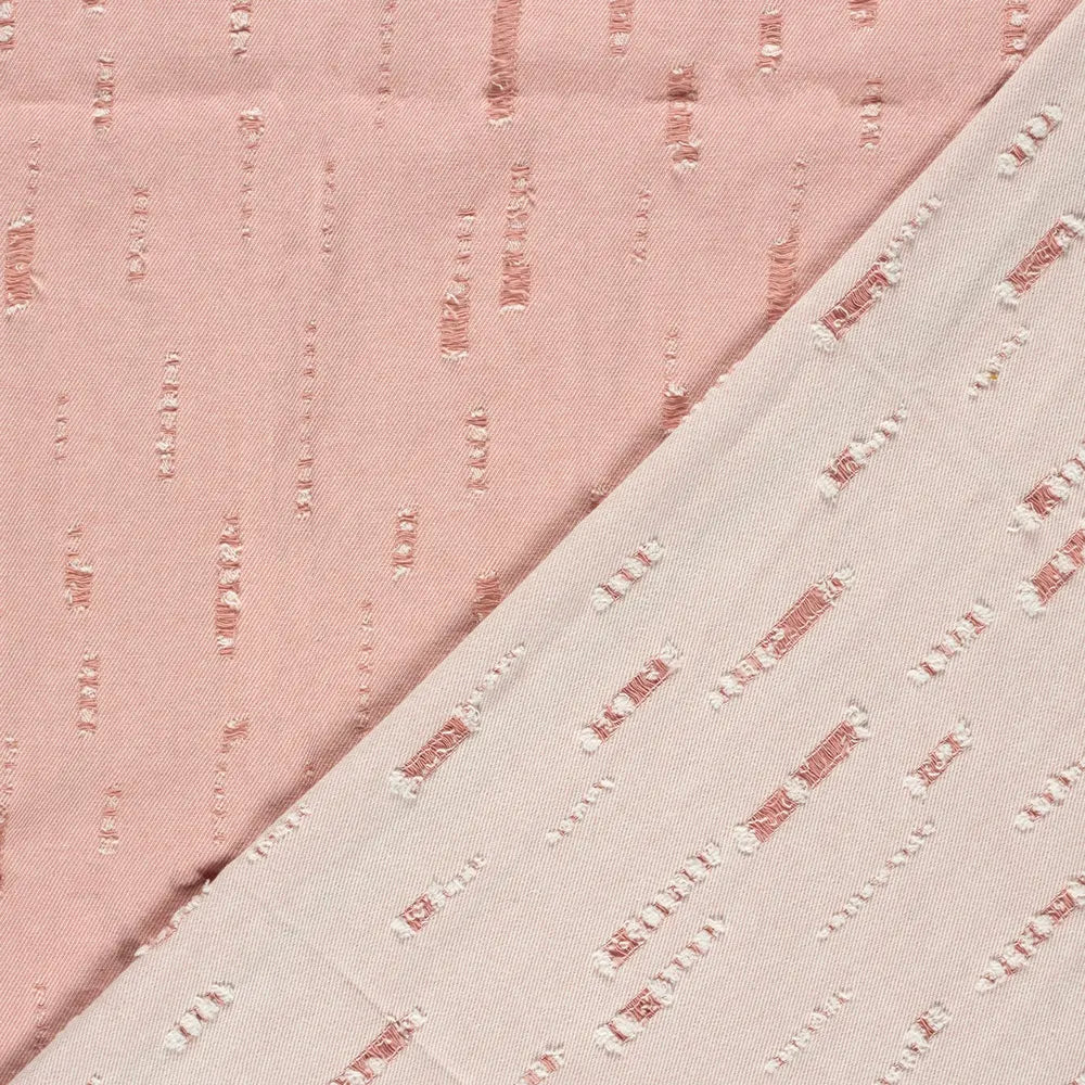 Rosa Jeansstoff in Destroyed Optik aus Baumwoll-Polyester-Mischung als robuste Meterware mit Used Look